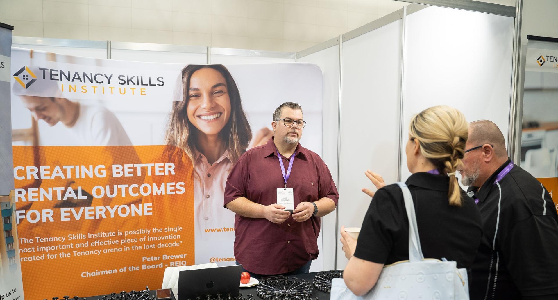 Spokesperson for business talking to a potential customers at exhibition